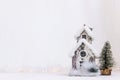 Christmas scee with little snow house and fir tree Royalty Free Stock Photo