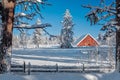 Christmas sceen of a red barn in winter snow Royalty Free Stock Photo