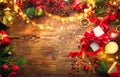 Christmas scene. Colorful wrapped gift boxes, beautiful Xmas and New Year backdrop with gift boxes, candles and lighting garland Royalty Free Stock Photo