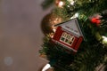 Christmas Scene. A fire house toy is hanging on the tree. Copy space. Royalty Free Stock Photo