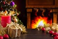 Christmas scene with fireplace and Christmas tree in the backgro Royalty Free Stock Photo