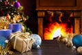 Christmas scene with fireplace and Christmas tree in the backgro Royalty Free Stock Photo