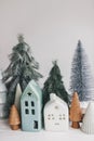 Christmas scene, miniature holiday village. Christmas little houses and trees on white background Royalty Free Stock Photo