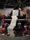 Christmas scene piano and music sheets surrounding by dressed polar bears Royalty Free Stock Photo