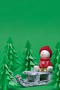 Christmas Scene. Christmas snowman on wooden sled. Royalty Free Stock Photo