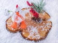 Christmas scene. Toy rooster and fir-cone with bunch of berries. Royalty Free Stock Photo