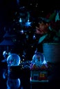 Christmas scene with tree, lights and snow globe. Selective focus on black background Royalty Free Stock Photo