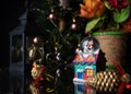 Christmas scene with tree, lights and snow globe. Selective focus on black background Royalty Free Stock Photo