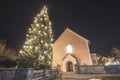 Christmas tree and lights in Austrian village at night Royalty Free Stock Photo
