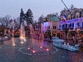 Christmas scenery at lake with waterspout fountain by dusk