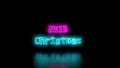 Christmas 2019 Sci-Fi blue cyan and Purple pink Neon Lights lettering word On Black Background wall and Reflective floor Royalty Free Stock Photo