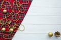 Scotish Christmas background. Golden balls, pine cones and golden beads decorations. Space for text. Royalty Free Stock Photo