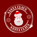 Christmas seal with the face of Santa Claus in red