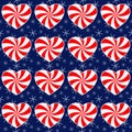 Christmas seamless pattern with candy canes in the shape of a heart and snowflakes Royalty Free Stock Photo