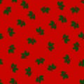 Christmas seamless pattern with holly leaves on red background, Royalty Free Stock Photo