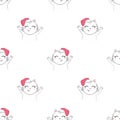 Christmas seamless pattern with the image of little cute kittens in the hat of Santa Claus. Royalty Free Stock Photo