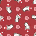 Christmas seamless pattern with the image of little cute kittens in the hat of Santa Claus. Royalty Free Stock Photo