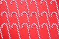 Christmas seamless pattern. Red colors. Candy canes and on red background Royalty Free Stock Photo