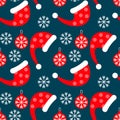 Christmas seamless pattern, Santa hats, balls and snowflakes. Graphic design for textiles, paper. Festive packaging. Royalty Free Stock Photo