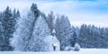 Christmas serene panoramic landscape tiny chapel in snowy frozen forest Royalty Free Stock Photo
