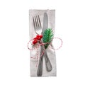 Christmas serving cutlery on a napkin, isolated on white background