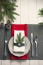 Christmas serving table. Traditional festive decoration background top view. Cutlery utensils beautiful plates decorative elements