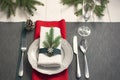 Christmas serving table. Traditional festive decoration background top view. Cutlery utensils beautiful plates decorative elements