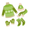 Christmas set of clothes, sweater, socks, hat, scarf and mittens. Green and white design with snowflakes. Royalty Free Stock Photo