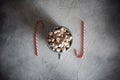 Christmas Setting With Hot Chocolate In A Fancy Sweater Mug With Marshmallows, Candy Canes, Wooden Deer And Xmas Lights On The