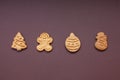 christmas shaped cookies on brown background