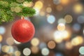 Christmas shiny ball on tree and Christmas lights, bokeh in background