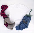 Christmas shirt mockup - white tshirt with buffalo plaid scarf, boots & jeans Royalty Free Stock Photo