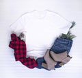 Christmas shirt mockup - white tshirt with buffalo plaid scarf, boots & jeans Royalty Free Stock Photo