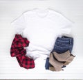 Christmas shirt mockup - white tshirt with buffalo plaid scarf, boots & jeans Royalty Free Stock Photo