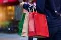 Christmas shopping - shopping bags in hand with snowflake Royalty Free Stock Photo