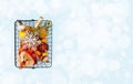 Christmas shopping basket with fruit and silver snowflake ornament Royalty Free Stock Photo