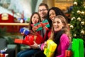 Christmas shopping - friends in mall Royalty Free Stock Photo