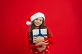 Christmas shopping. Happy winter holidays. Small girl. Little girl child in santa red hat. Present for Xmas. Childhood Royalty Free Stock Photo