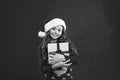 Christmas shopping. Happy winter holidays. Small girl. Little girl child in santa red hat. Present for Xmas. Childhood Royalty Free Stock Photo