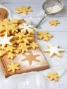 Christmas shortbread cookies in the form of snowflakes sprinkling sugar and cookie cutters. Xmas card concept Royalty Free Stock Photo