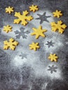 Christmas shortbread cookies in the form of snowflakes sprinkling sugar and cookie cutters. Xmas card concept. Royalty Free Stock Photo