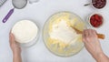 Christmas shortbread cookies with raspberry preserves recipe. Chef mixing ingredients in a glass bowl Royalty Free Stock Photo