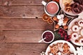 Christmas baking side border of assorted sweets and cookies, top view over a rustic wood background