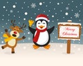 Christmas Sign - Reindeer & Cute Penguin Royalty Free Stock Photo