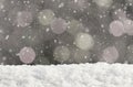 Christmas silver background with bokeh lights and falling snow Royalty Free Stock Photo