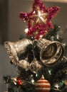 Christmas Silver bell and star hanging on a beautiful Chrismas t Royalty Free Stock Photo