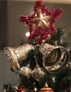 Christmas Silver bell and star hanging on a beautiful Chrismas t Royalty Free Stock Photo