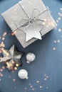 Christmas silver handmade gift boxes on blue background top view. Merry Christmas greeting card, frame. Winter xmas holiday theme. Royalty Free Stock Photo