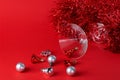 Christmas silver and red toys in a glass goblet Royalty Free Stock Photo