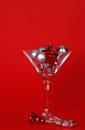 Christmas silver and red toys in a glass goblet Royalty Free Stock Photo